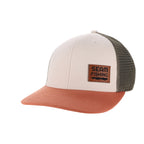 Trucker hat with beige front, brown visor, and green mesh back on a white background (global)