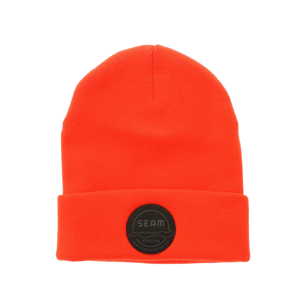 Hunter orange beanie with a black seam patch (global).